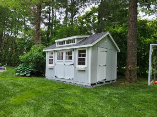 10' X 14' wood garden with 6 lite doors transom dormer